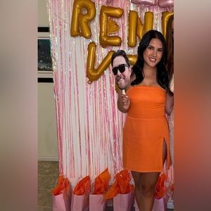 Orange revolve mini dress.